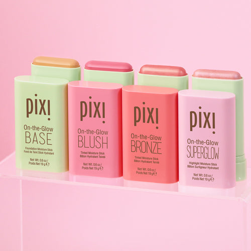 Petra's Complete Glow Kit shown on a pink background. view 1