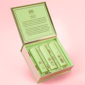 Set of Pixi perfume products in a green box on a pink background
