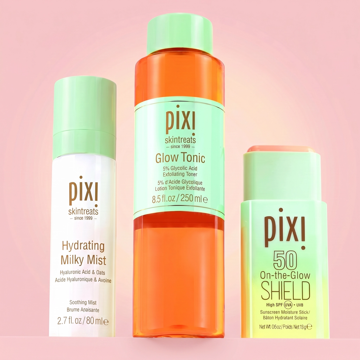Pixi skincare products including Hydrating Milky Mist, Glow Tonic, and On-the-Glow Shield on a pink background